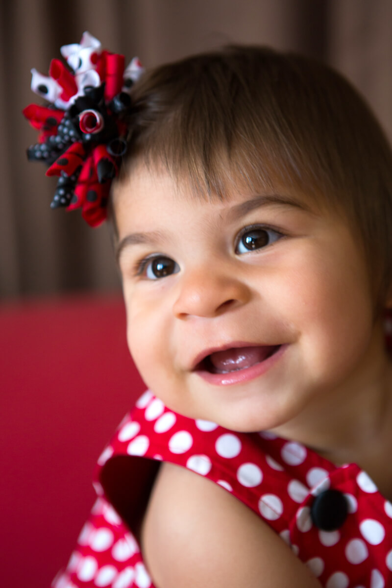 Smiling baby dressed in red white and blue