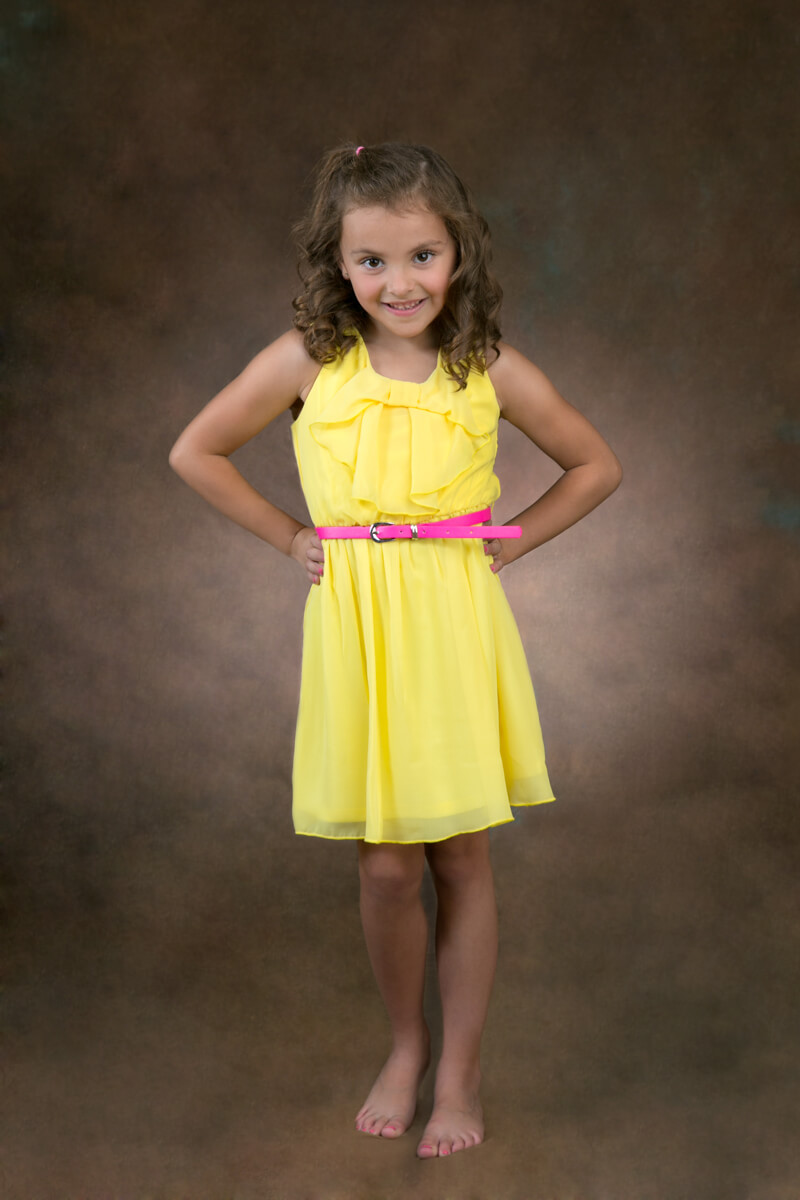 Fun pose of little girl for portrait session