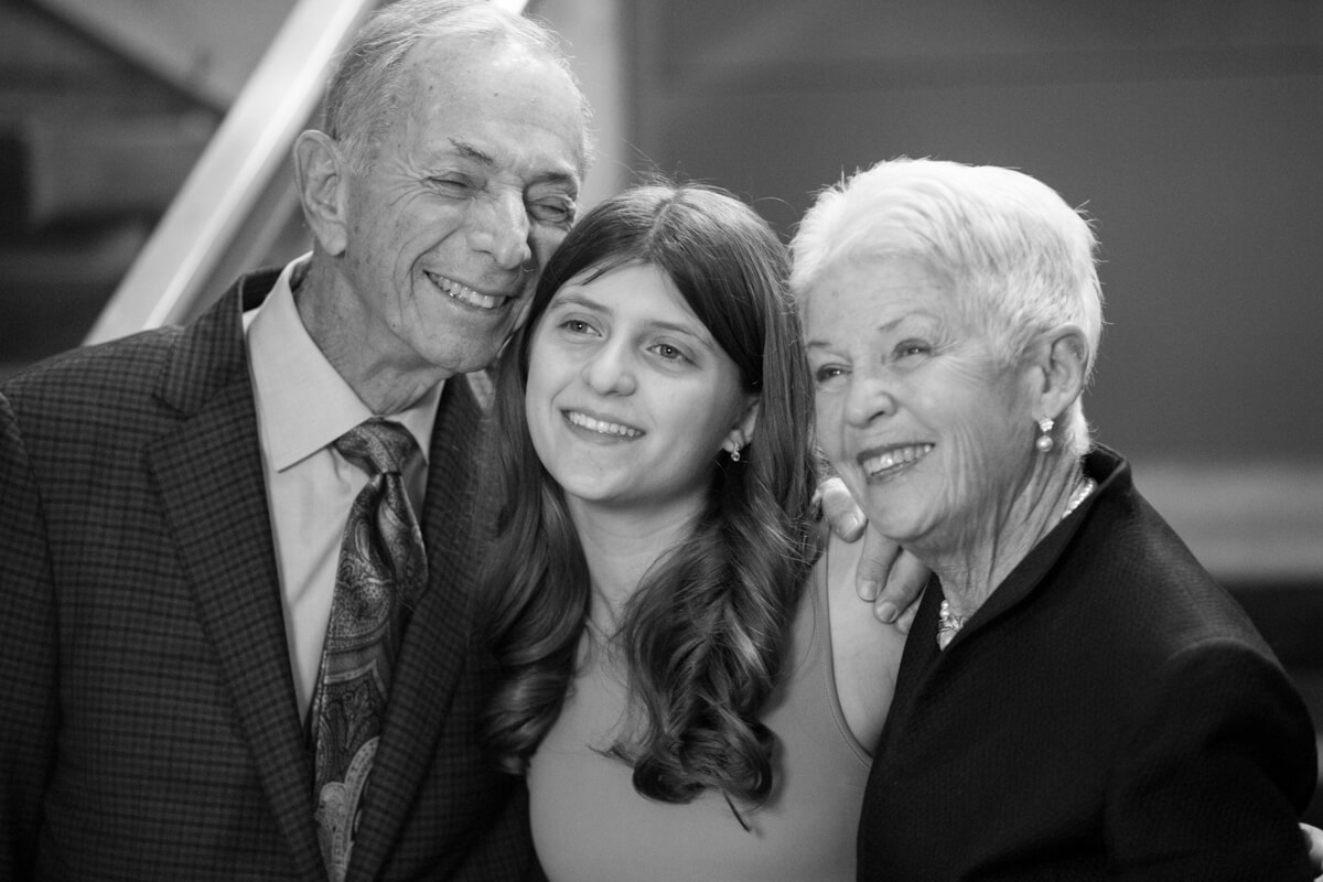 Candid photo with grandparents at Bat Mitzvah