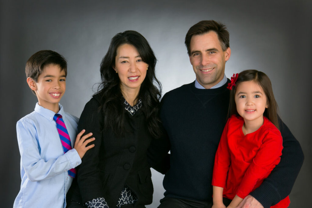 Young couple portrait with two children