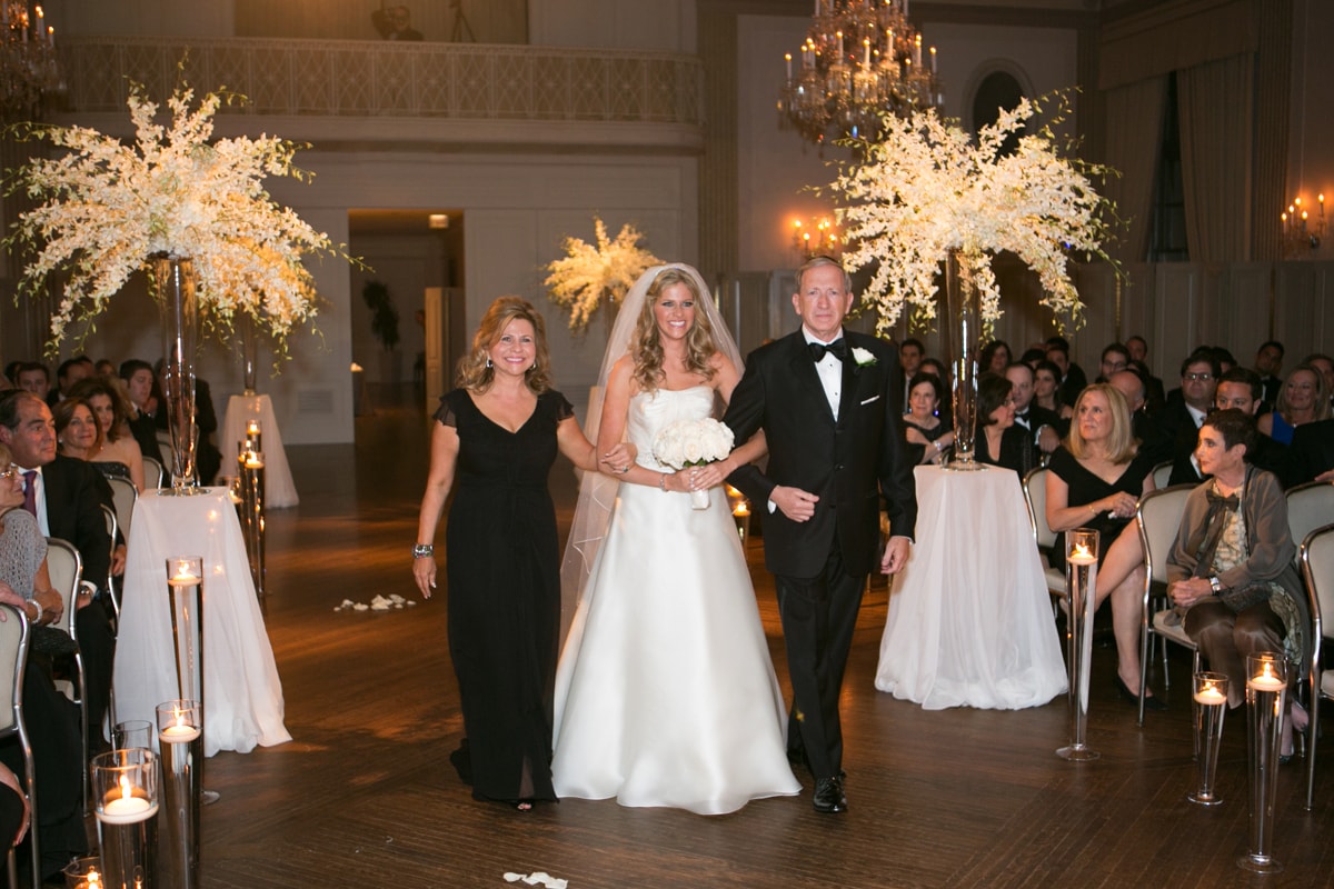 Bride enters wedding ceremony with parents at Standard Club Chicago