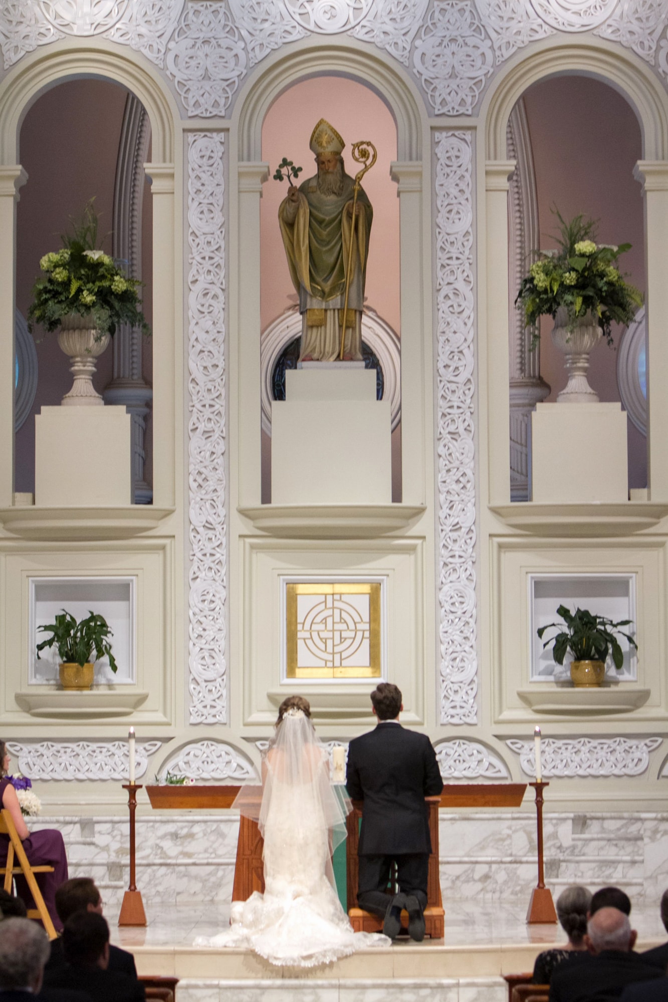 Prayer during wedding ceremony at Old St. Patricks Chicago