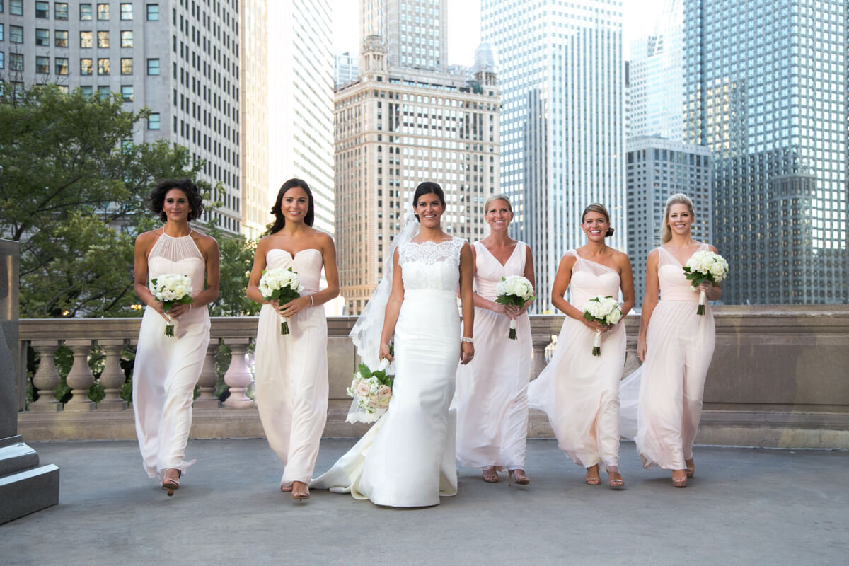 Bridesmaid walk in fun candid in Chicago