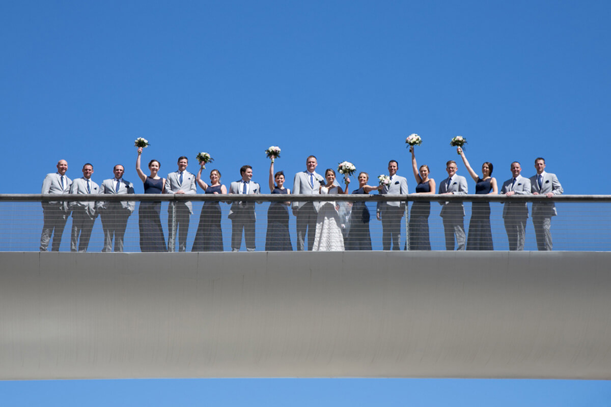 Wedding party portrait on bridge at Chicago's Millenium park