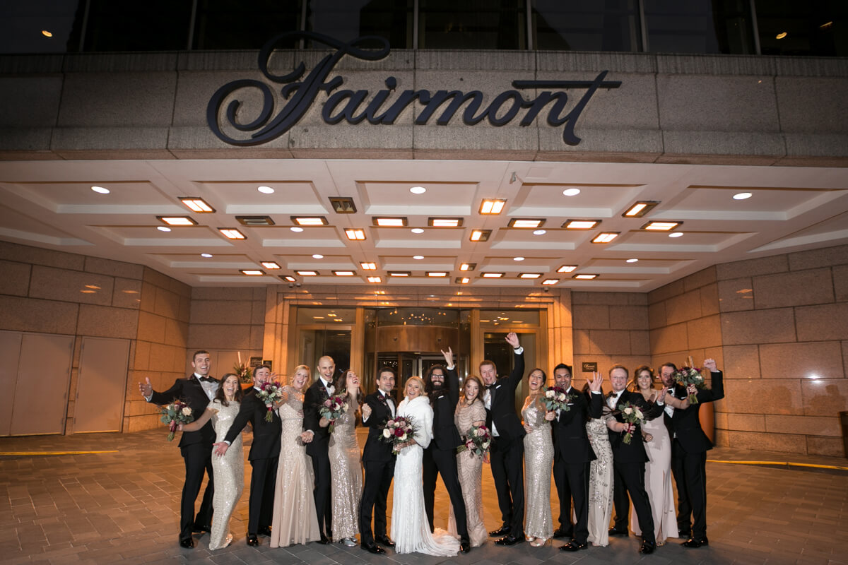Wedding Party poses in front of the Fairmont Chicago