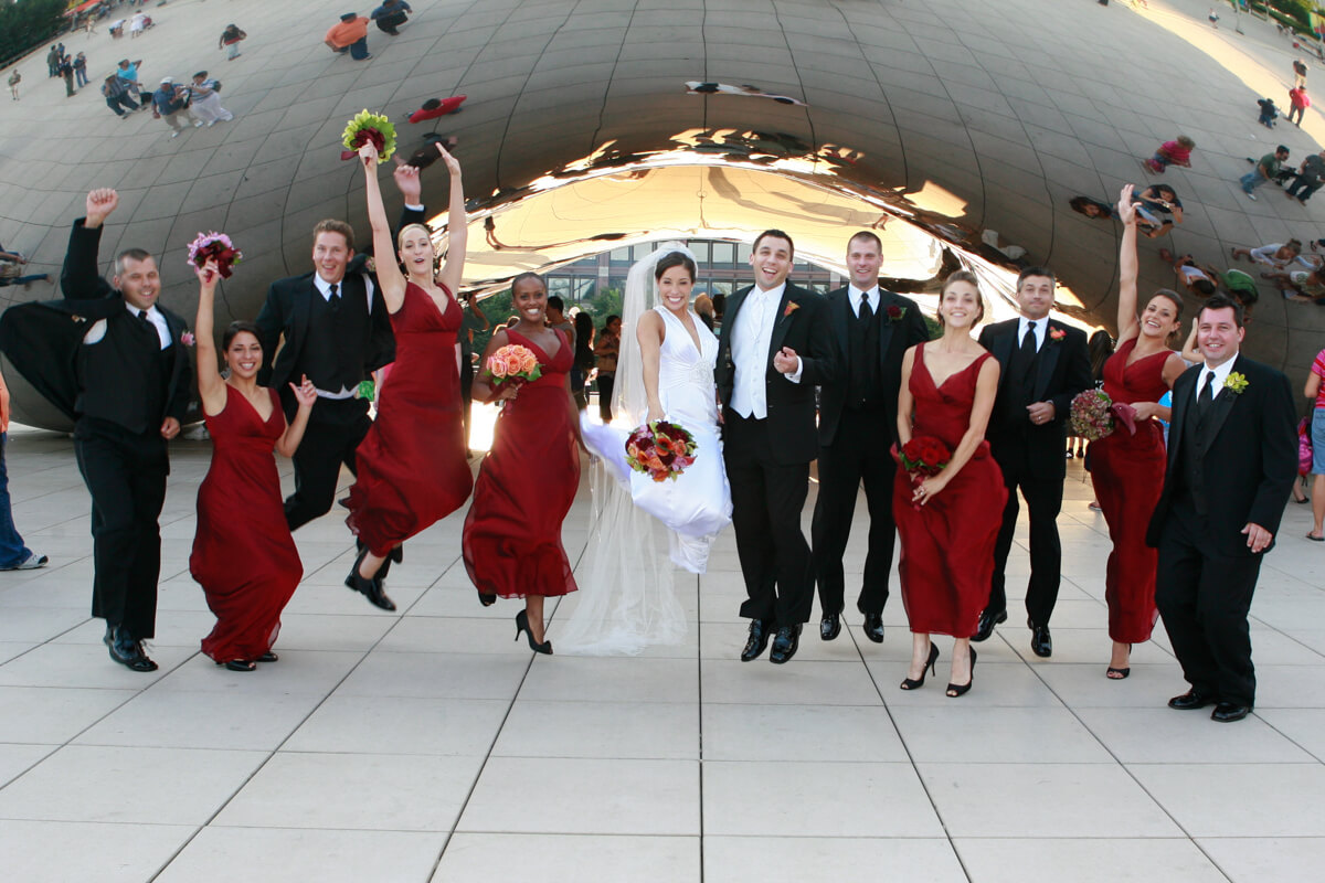 Wedding Party jumps in front of Chicago's Bean