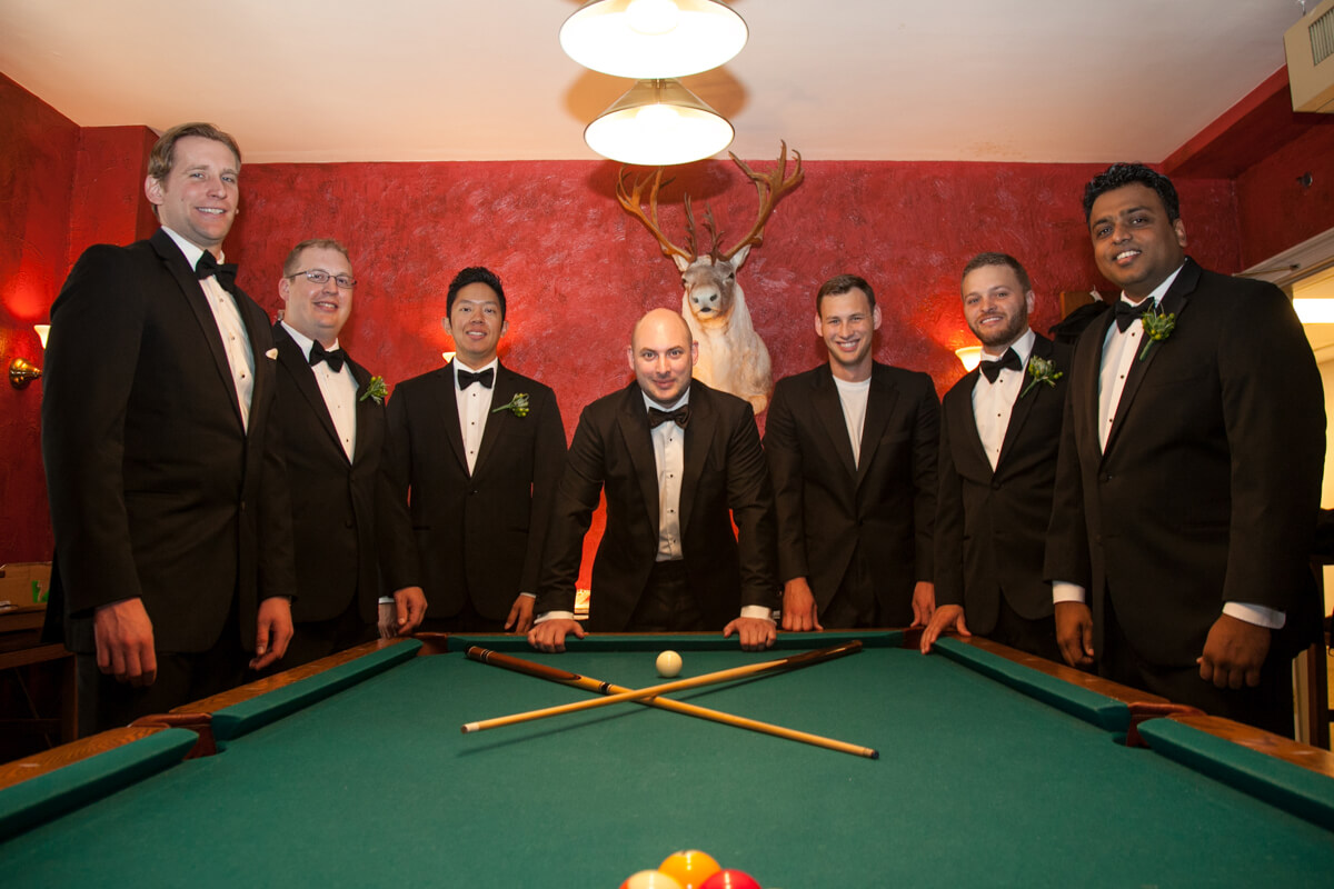 Creative photo of groomsmen playing pool