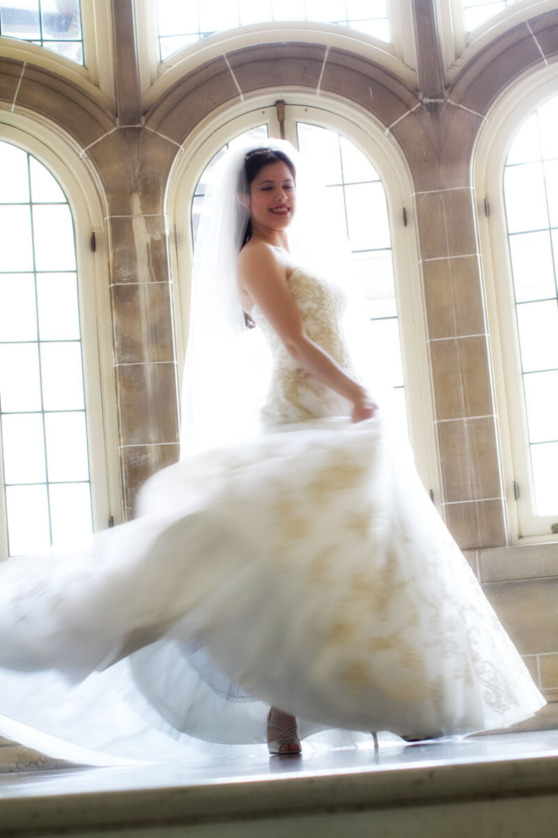 Bride twirls dress on stairs of Armour House