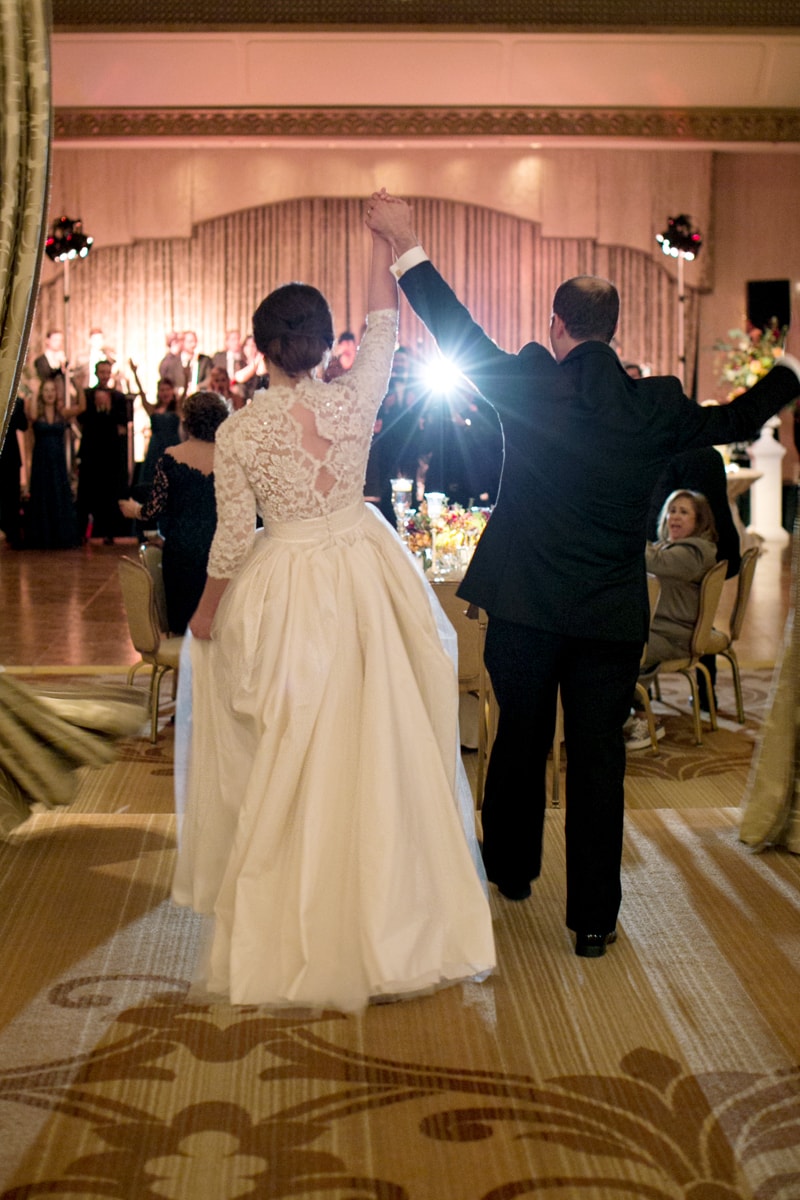 Bride and groom enter the reception at the Ritz Calton