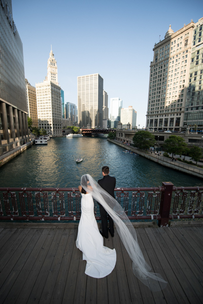 bride and groom at chicago river
