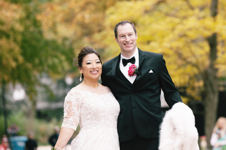 Fall colors are a wonderful backdrop for this wedding portrait