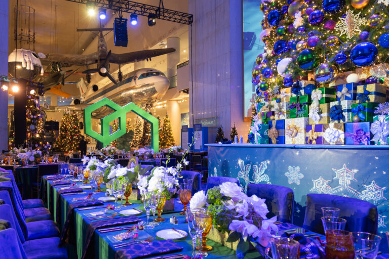 Chicago corporate event photography at the Museum of Science and Industry featuring an elegant anniversary dinner and holiday décor.