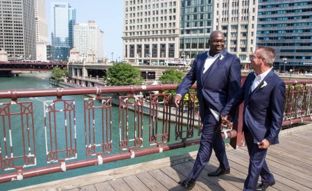 LGBT Wedding Couple crossing the Chicago River bridge